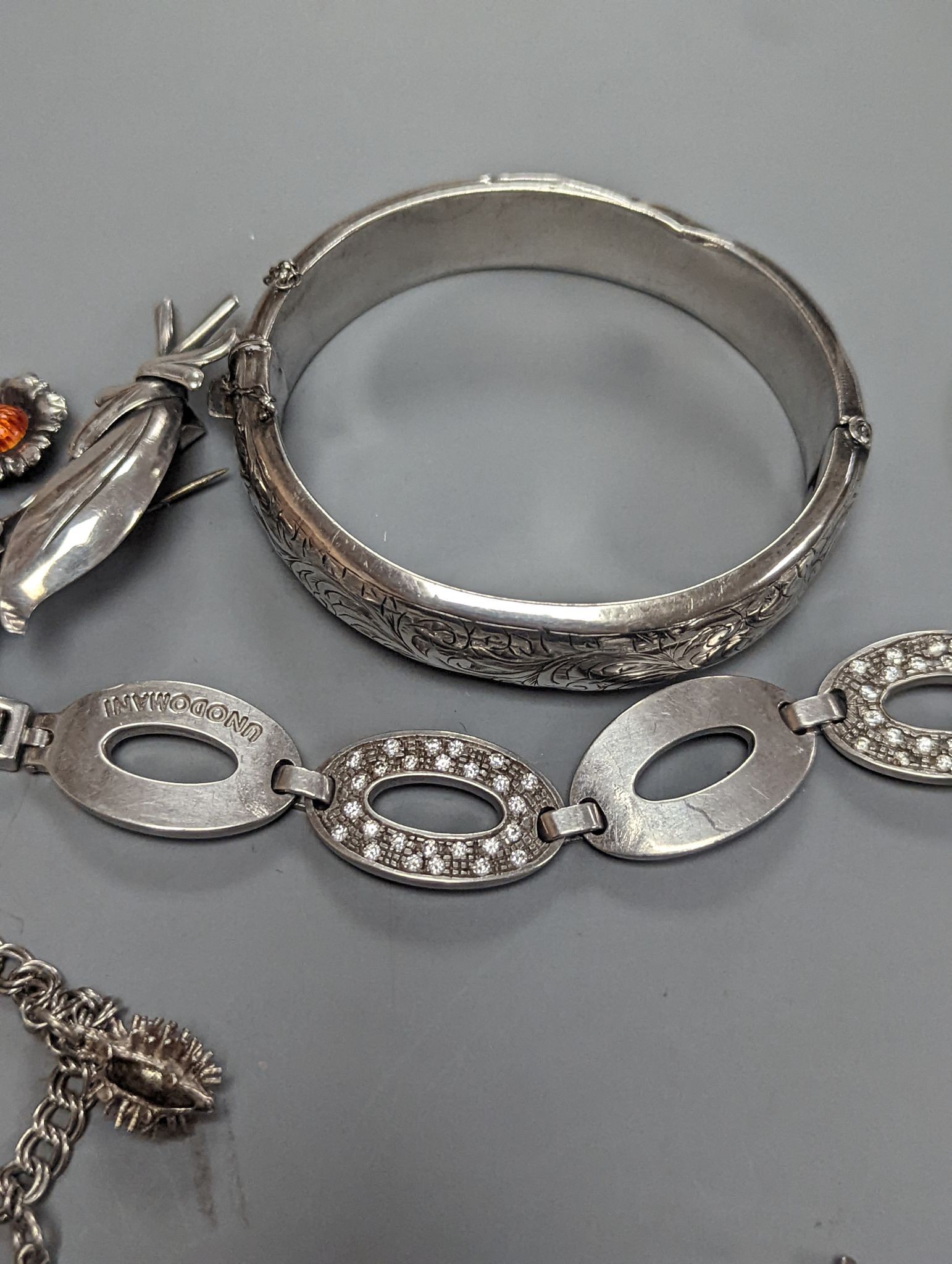 A quantity of assorted jewellery etc. including Danish sterling bangle and leaf brooch, a white meta and niello bracelet and a 925 and enamel flower brooch.